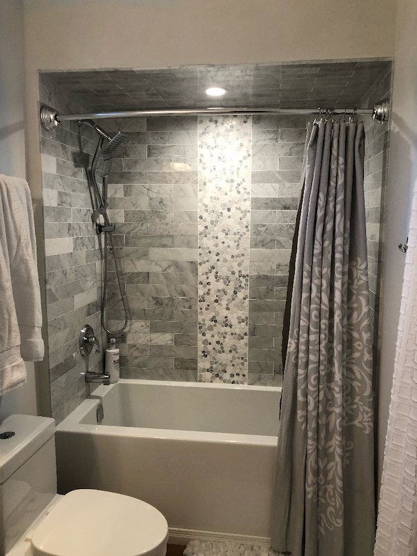Shower tile renovation with marble tile